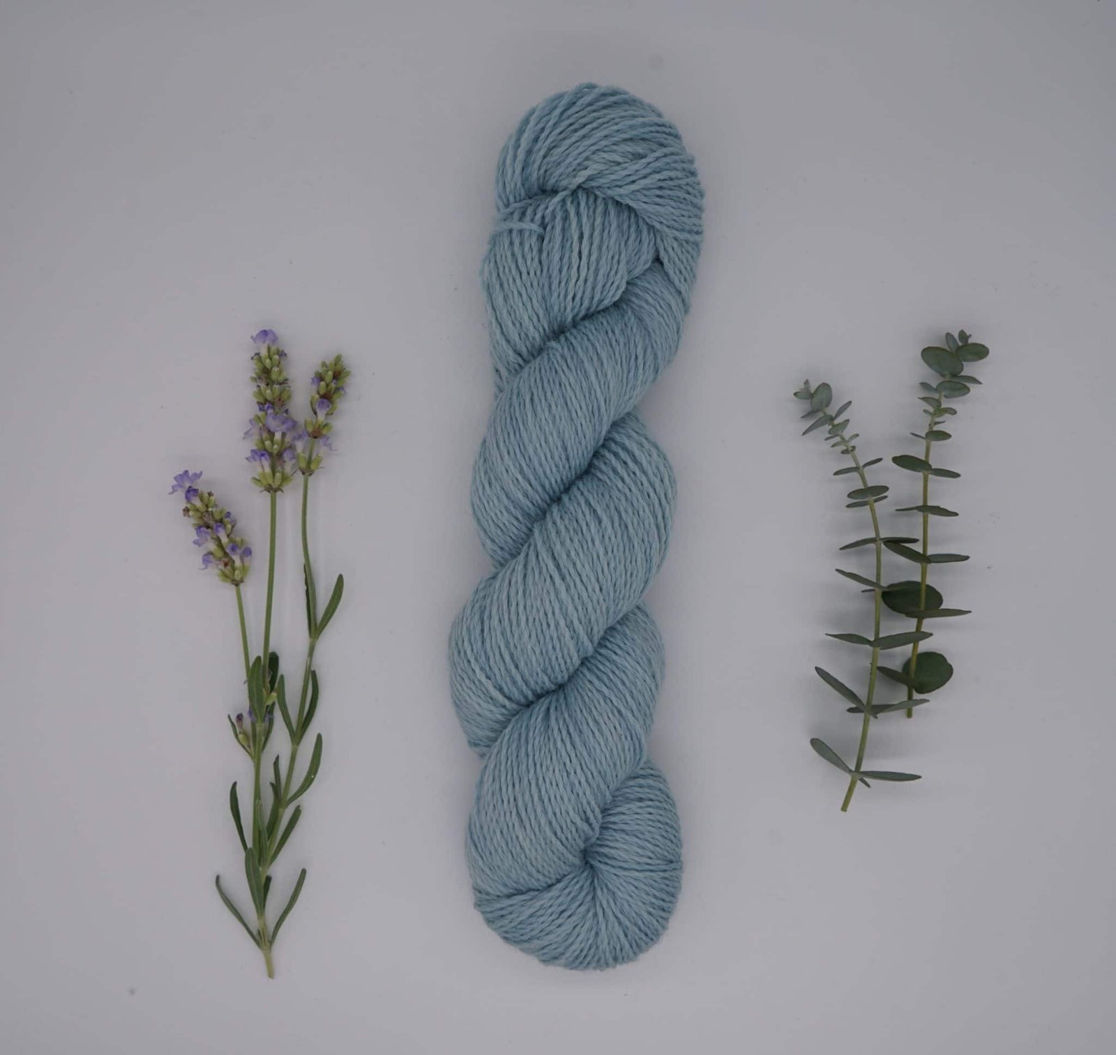 naturally dyed skein of yarn with flowers and leaves
