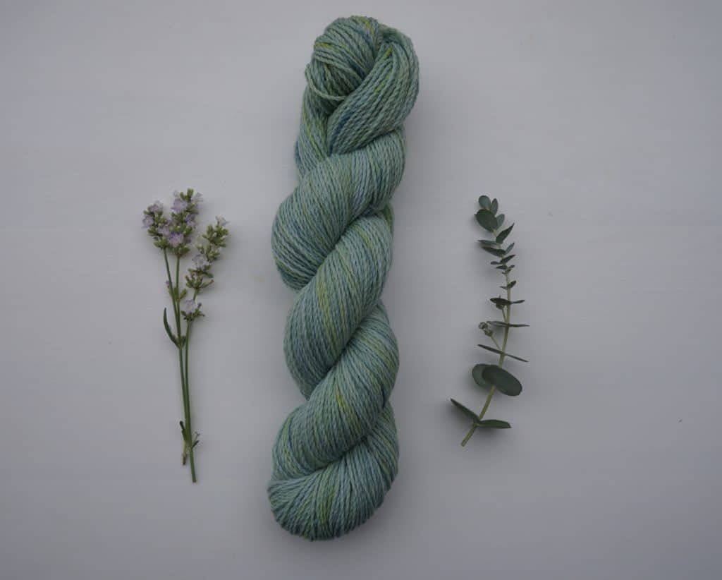 skein of naturally dyed yarn dyed with goldenrod and indigo
