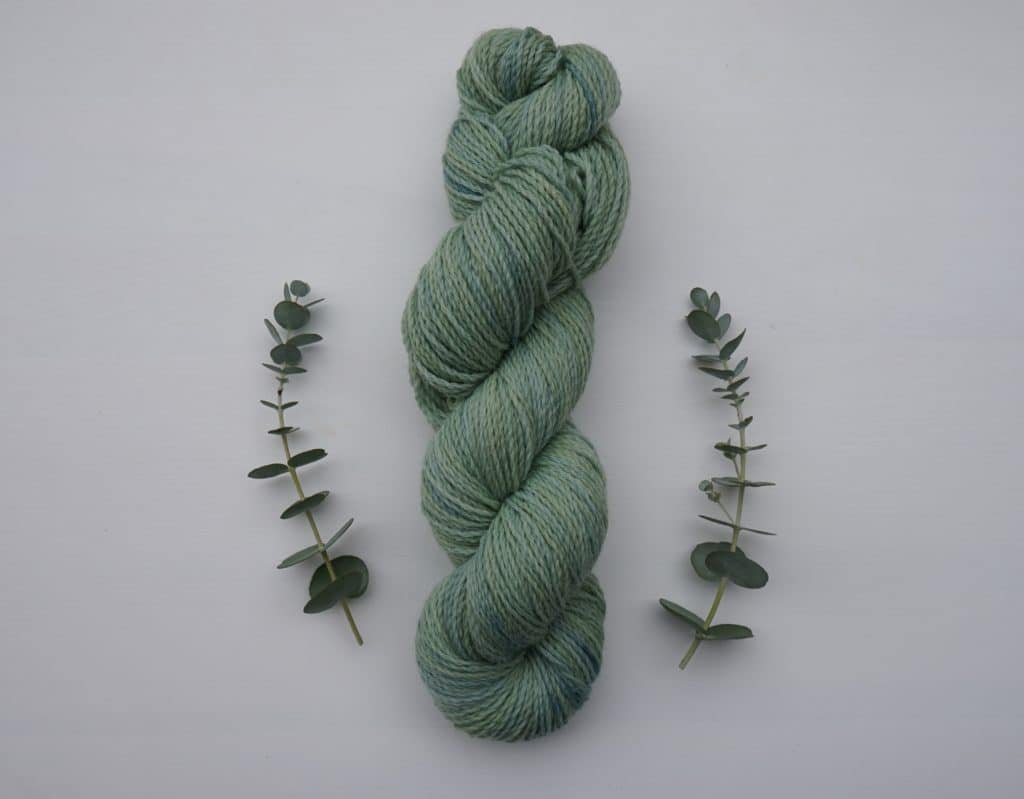 skein of naturally dyed yarn dyed with goldenrod and indigo