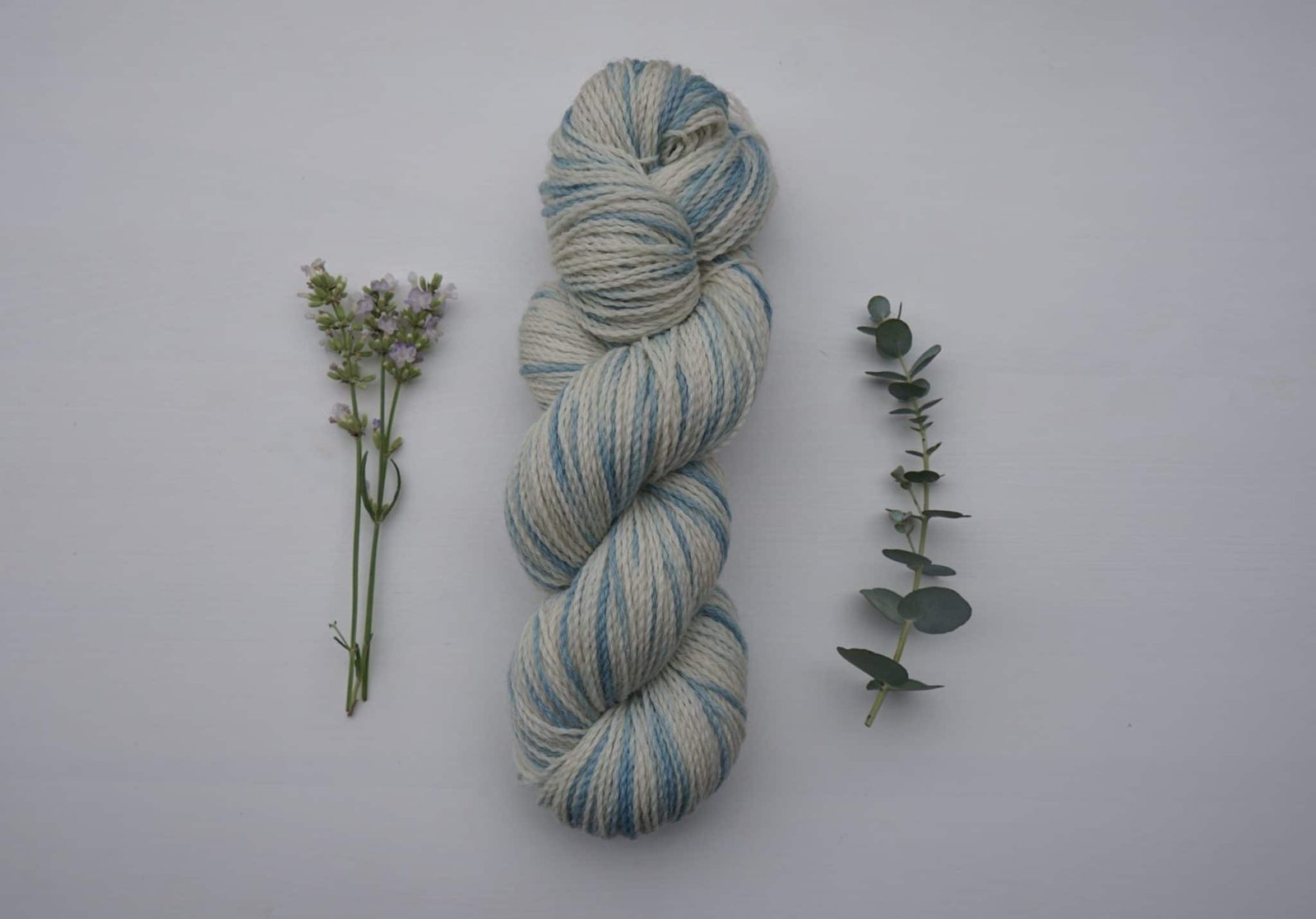naturally dyed skein of yarn dyed with indigo speckles