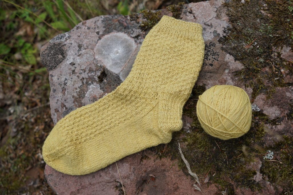 one handknitted yellow sock rosemary & pines fiber arts