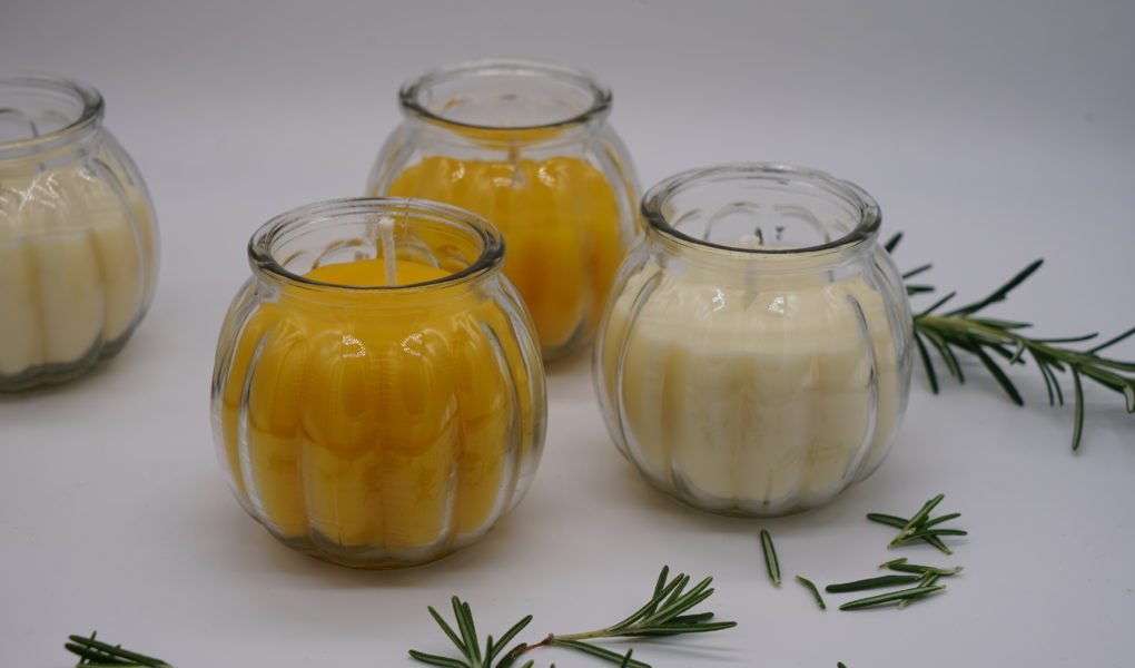 two handmade natural beeswax and two rapeseed wax candles