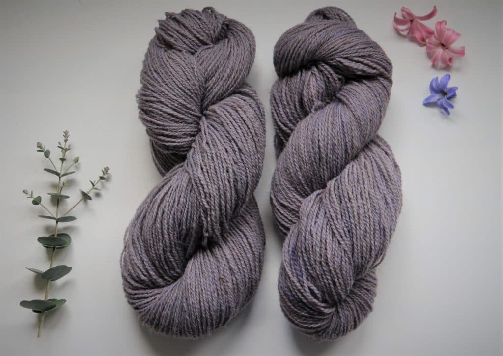 two naturally dyed purple skeins of Coburg Fox yarn