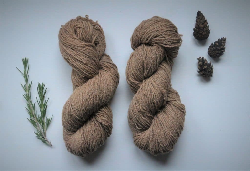 two naturally dyed light brown skeins of Coburger Fuchsschaf yarn
