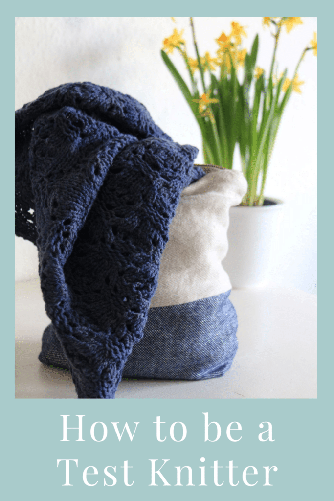a dark blue piece of knitwear peeking out of a bag in front of some daffodils on a white sideboard and a text saying: how to be a test knitter