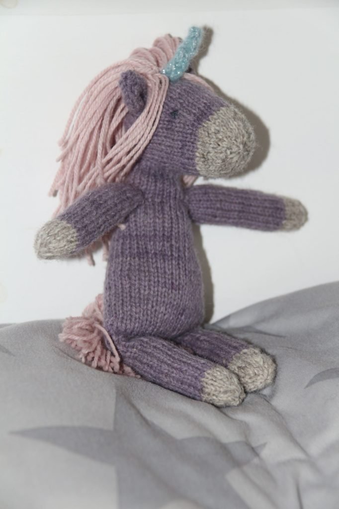 nilla the unicorn made out of rosemary & pines fiber arts sock yarn