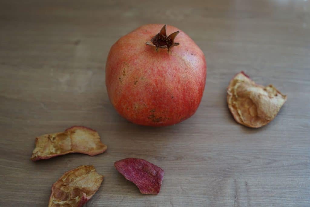 pomegranate fruit and dried pomegranate skins kitchen scraps for natural dyeing