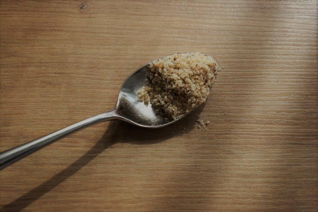 shredded hazelnuts on a spoon