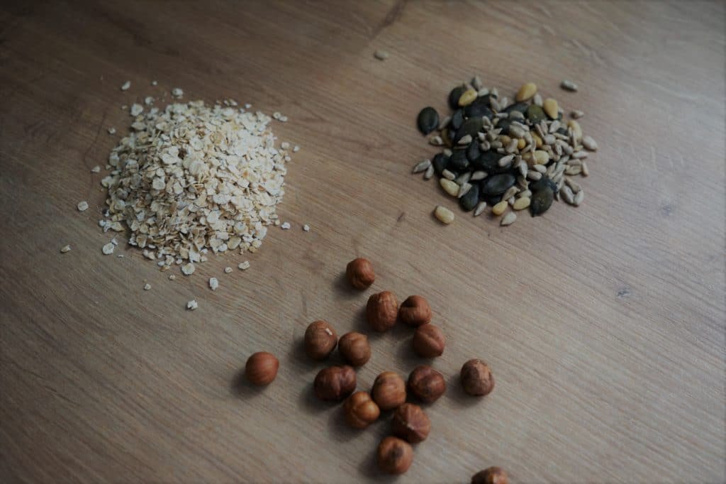 oats, seds and hazelnuts ingredients for granola