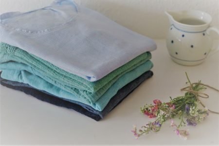 stack of handmade clothing