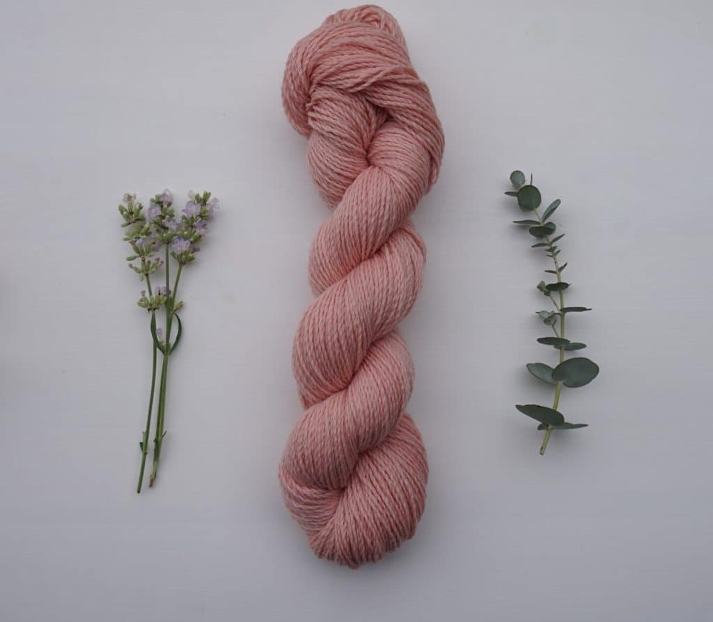 light coral pink skein of yarn, naturally dyed with cochineal