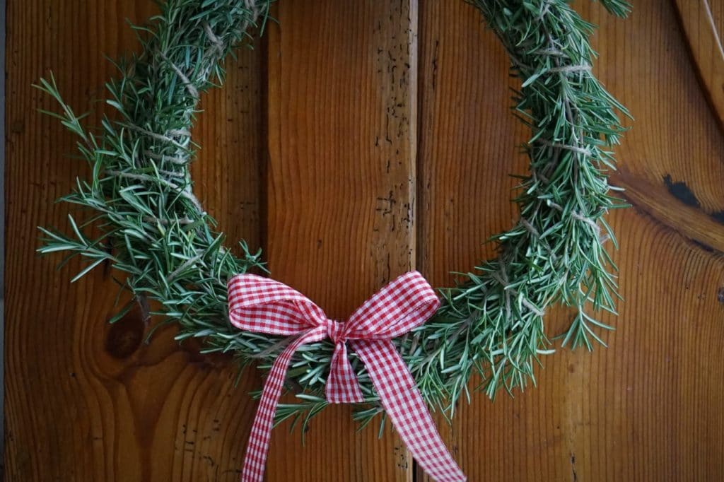 rosemary wreath with red gingham ribbon