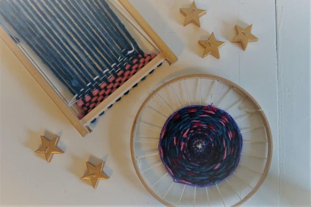 two weaving looms for children and some golden star candles