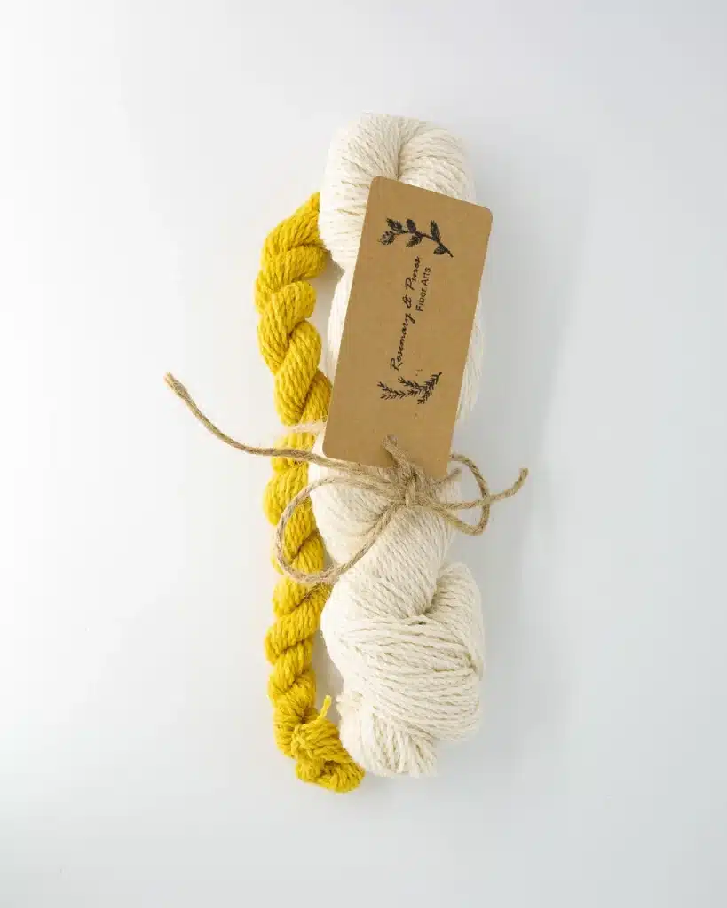 set of a full skein in natural white and a contrasting yellow mini skein