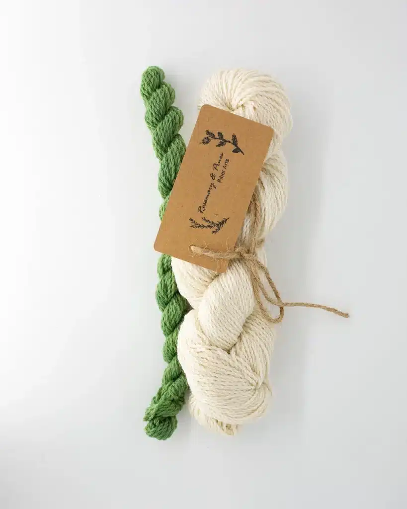 set of a full skein in natural white and a contrasting green mini skein