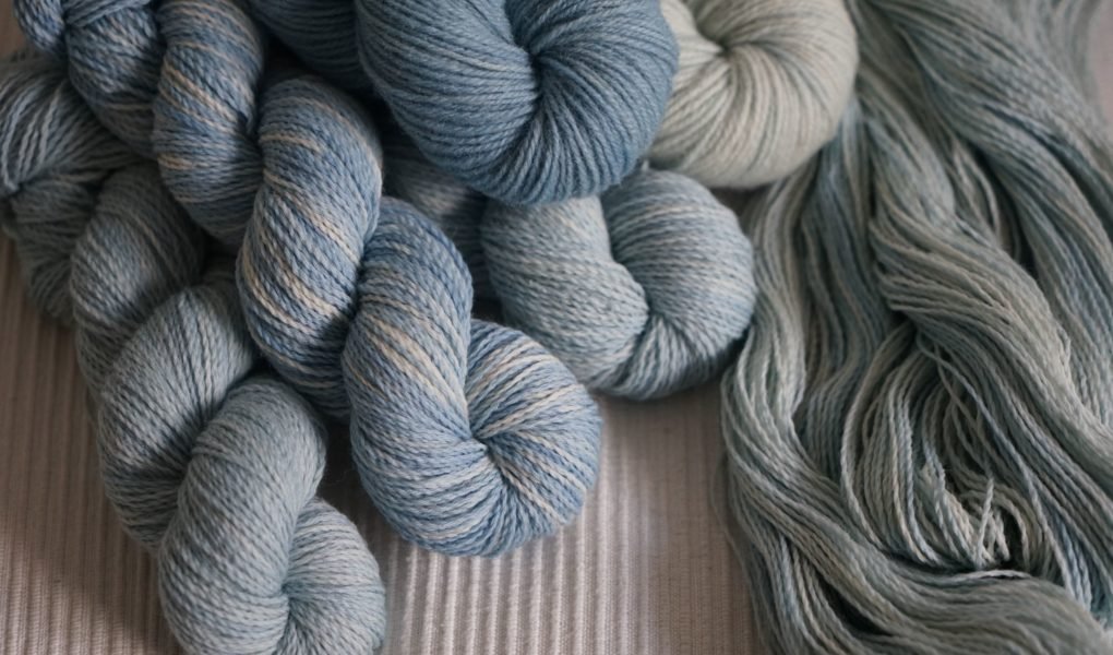 blue coloured yarns on a natural coloured fabric