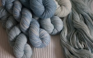 blue coloured yarns on a natural coloured fabric