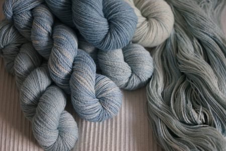 blue coloured yarns on a natural coloured fabric