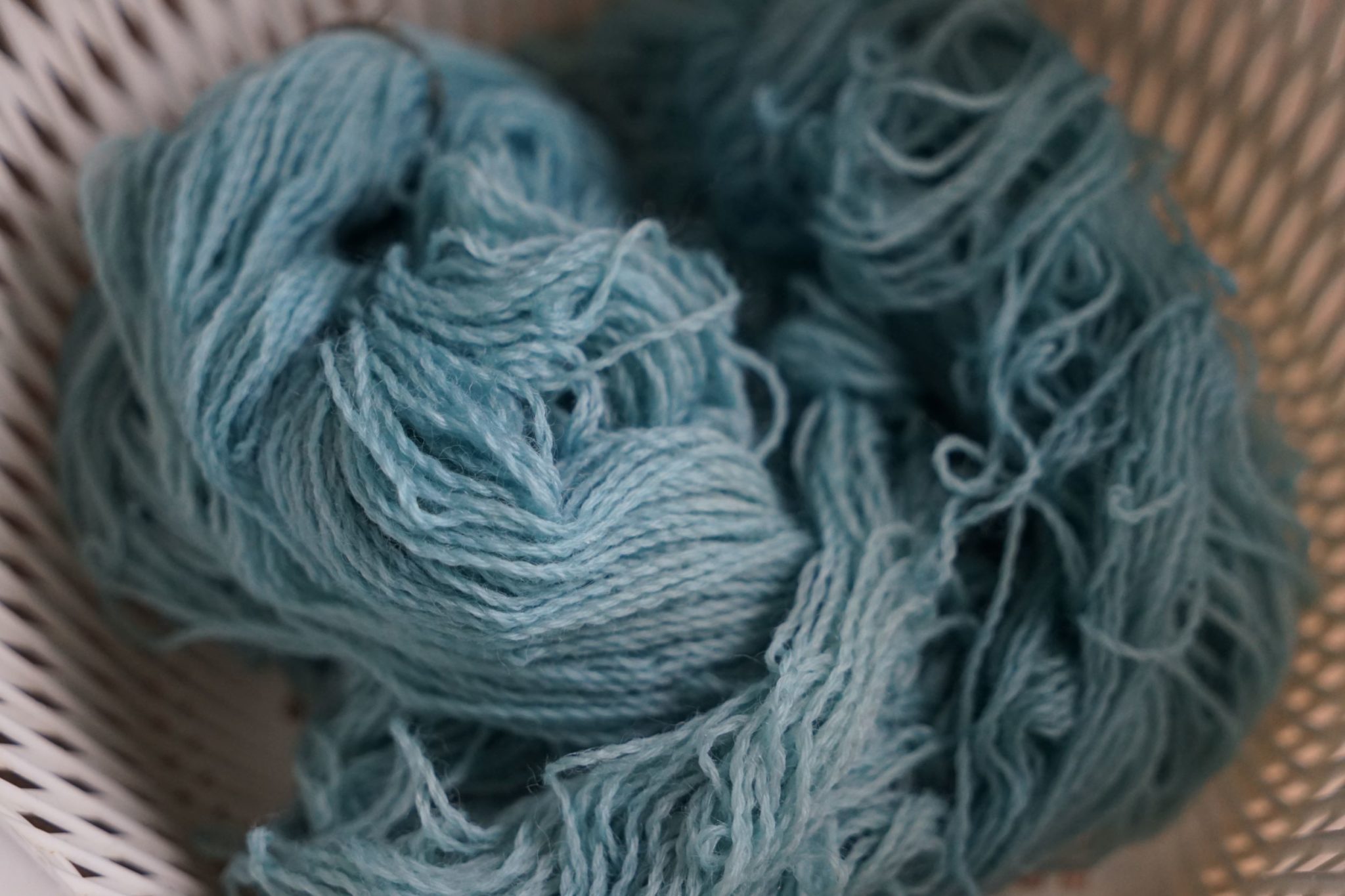indigo dyed skein of yarn in light blue