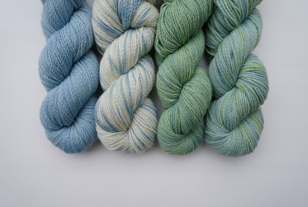four different colourways in greens and blue achieved by dyeing with indigo