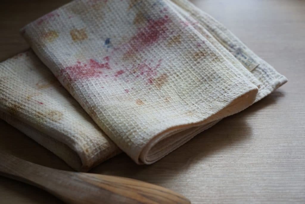 two colorful kitchen towels naturally dyed