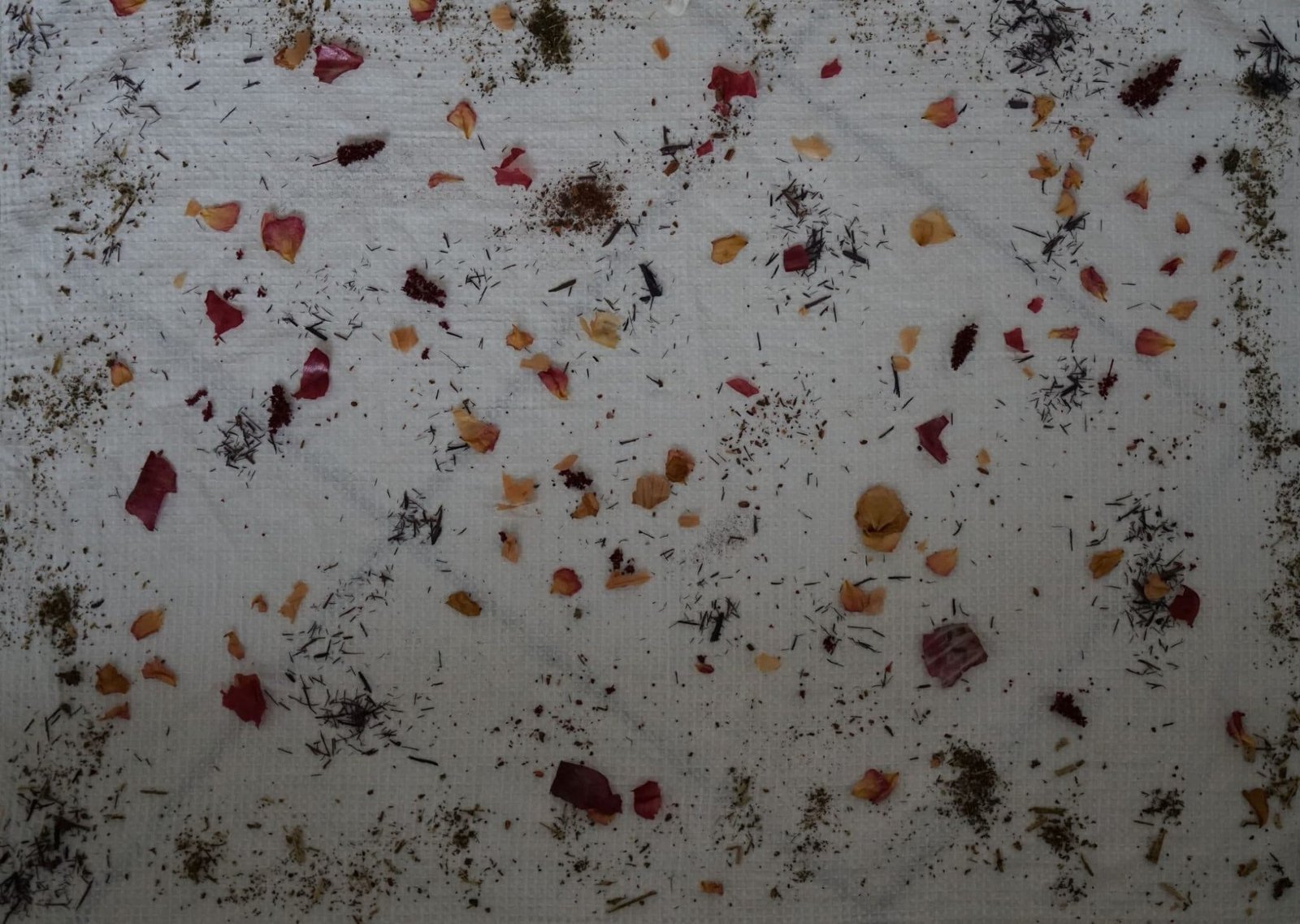 kitchen towel with dye stuff sprinkled all over it