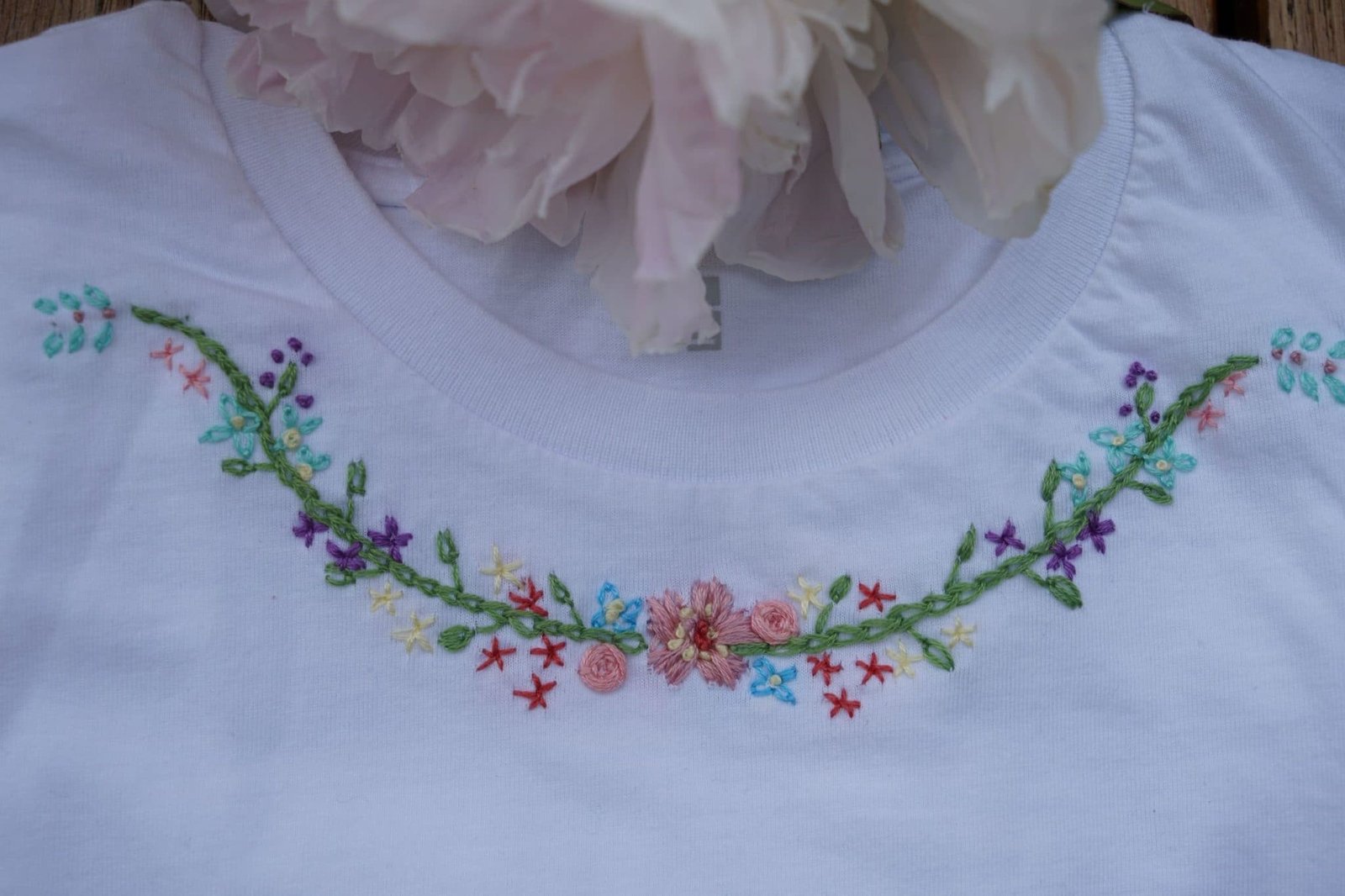 floral border embroidery on a white cotton shirt