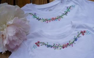 two embroidered white shirts and a large pink peony bloom