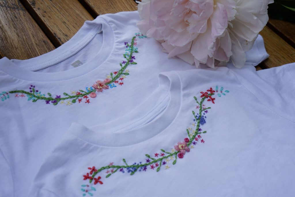 two embroidered white shirts and a light pink peony bloom