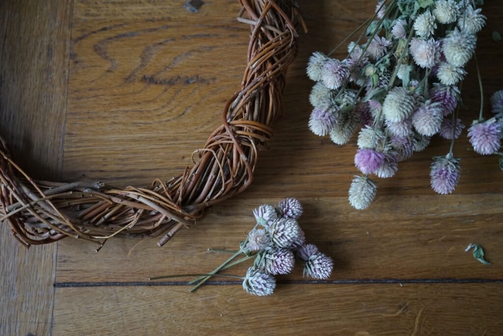 dried gomphrena stems in small bundles to make a dried flower wreath