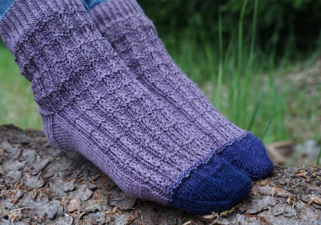 barre socks knitting pattern close up of feet