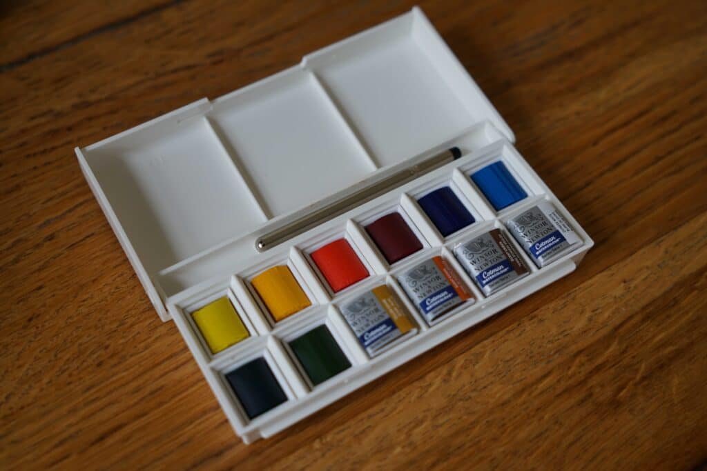 brand new watercolor palette by winsor & newton on a wooden table