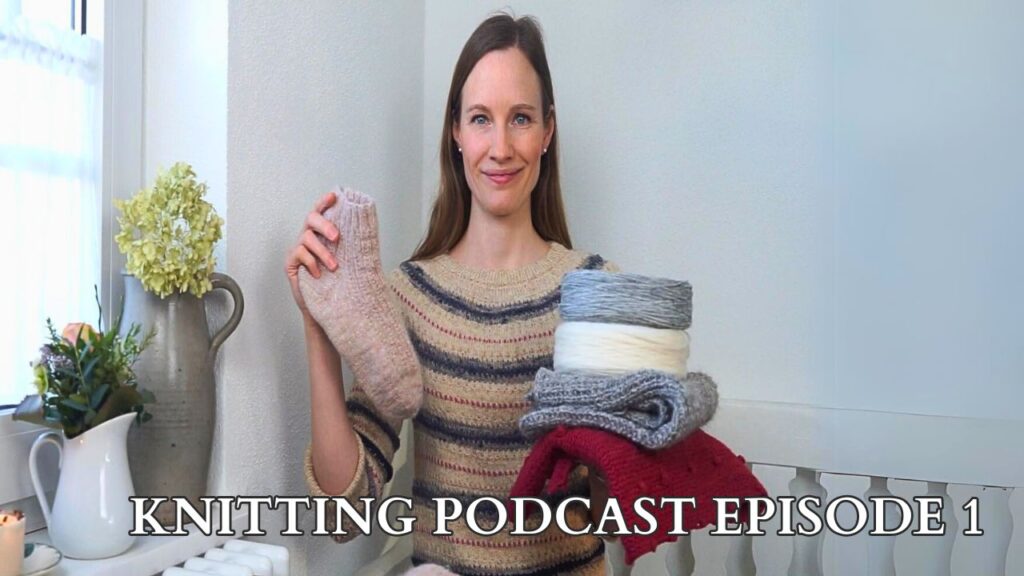 a woman holding several handmade knitted items and a text saying knitting podcast episode 1